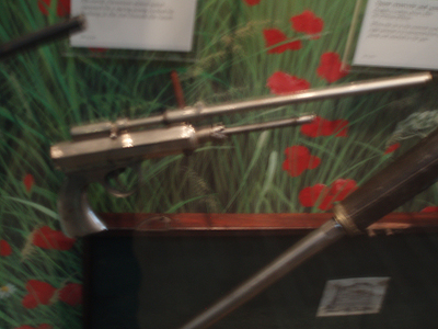 The air gun is based on one that I snapped in the Police Museum of Paris (Le Musée de la Prefecture), which is housed in the police station of the 5th arrondisement, which is a bit unnerving to be in, as it’s milling with suspects and perps the cops have arrested or have taken in for questioning. It’s strictly forbidden to take photos in there, which is why the snaps are a bit blurry, taken with the flash off and held so as not to be spotted by the surveillance cameras.